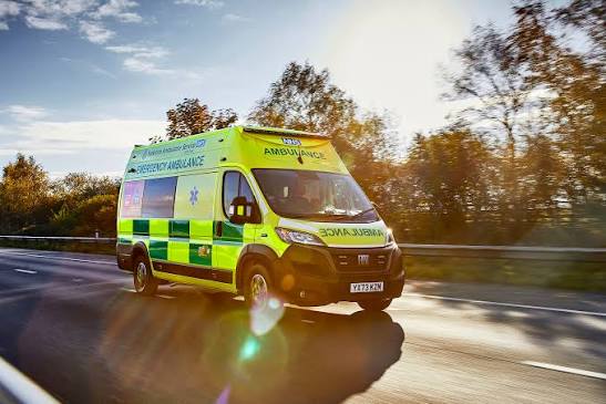 Medical transportation team assisting a patient